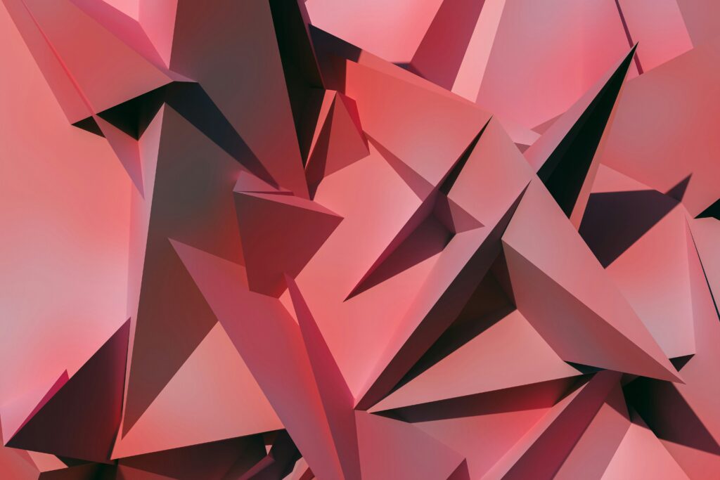 Close-up of red geometric shapes with sharp edges forming a complex pattern.